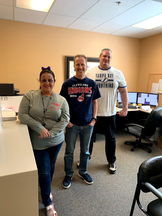 Account Services team members show their Halloween spirit in their favorite team attire.